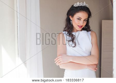 Portrait of bride wedding dress Crown curls hairstyle