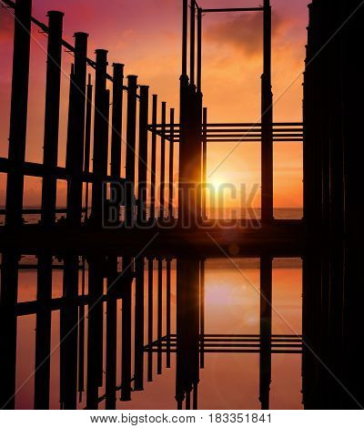 abandon buildings in the sea with sunset
