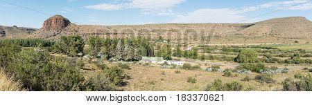 NIEU BETHESDA SOUTH AFRICA - MARCH 22 2017: A road stall and the Tower next to the scenic Owl Route to Nieu-Bethesda an historic village in the Eastern Cape Province