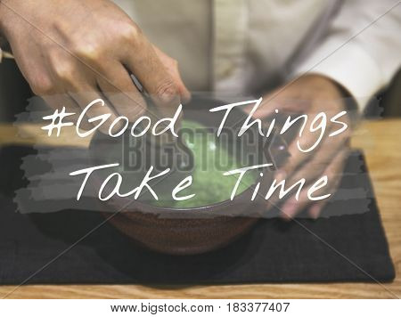 Hands with Japanese Green Tea and Good things Take Time Quote