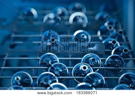 It help in cabinet. Close up of sterilized ear-funnels lying on bar screen being ready for use