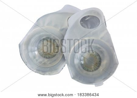 Pair of brand new breathable monthly disposable contact lenses in Gray color made of silicone hydrogel isolated on white background