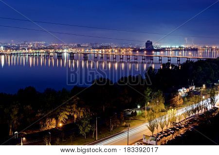 Night view of city of Dnipro near river