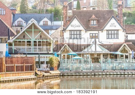 GUILDFORD, UK - APRIL 6: The popular Weyside restaurant and pub on the banks of the River Wey near Guildford, UK on April 6, 2017