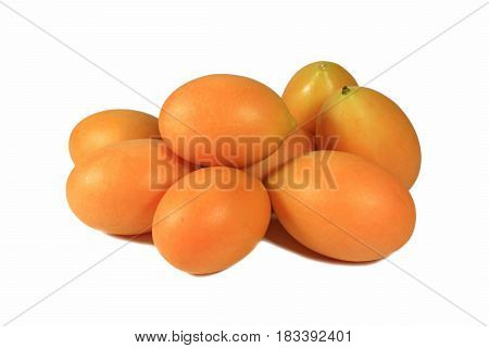 Closed up Pile of Bright Orange Yellow Ripe Marian Plums Isolated on White Background