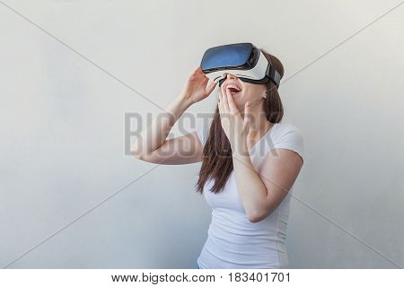 Smile happy young woman using the virtual reality headset on white background