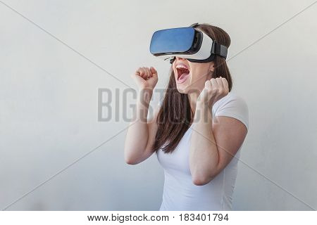 Smile happy young woman using the virtual reality headset on white background