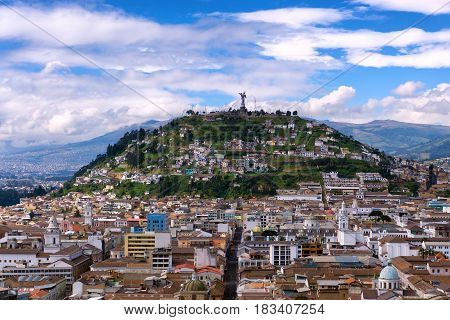 View of the historic center of Quito Ecuador as with Panecillo hill rising in the background