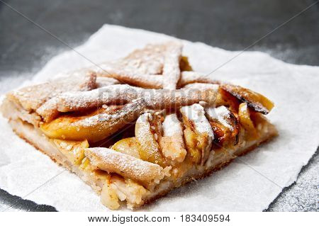 Apple Pie on disposable paper plate. Double crust apple pie with cinnamon made with shortcrust pastry.