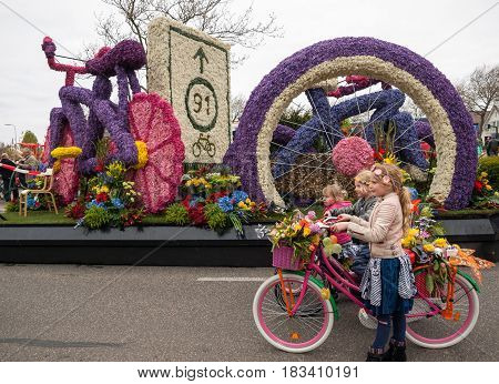 NOORDWIJKERHOUT NETHERLANDS - 21 APRIL 2017: Platform with tulips and hyacinths follows the route of the traditional flowers parade Bloemencorso from Noordwijk to Haarlem in the Netherlands.