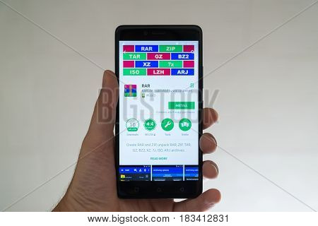 Paris, France, april 22, 2017: Rar application on google play store on smartphone
