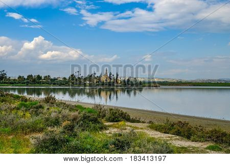 Ancient mosque on the Aliki salt lake Larnaca. A springtime shot with lovely reflections.