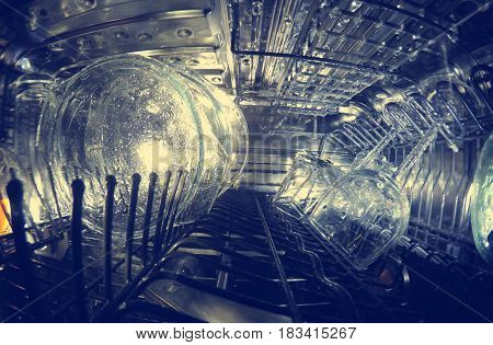 the dishwasher washes the glasswares dishes toning