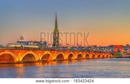 Pont de Pierre bridge and Saint Michel Basilica in Bordeaux - France, Gironde