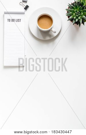business plan with to do list and coffee in management set on white office table background top view mock-up