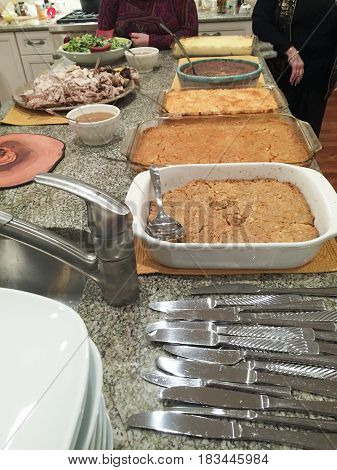 Various Dishes And Casseroles At A Thanksgiving Pot Luck