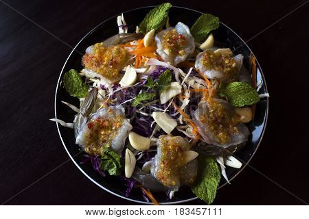 raw prawns with Thai spicy sauce on top.