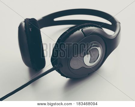 Headphone and Smartphone in Workplace, Isolated Elegance Background