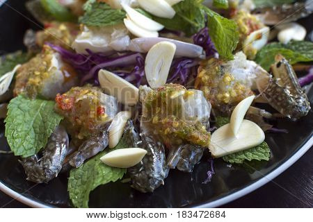 Thai Spicy Sauce on top of raw crabs.