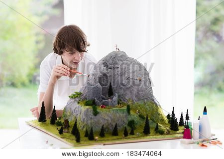 School Student Working On Model Building Project