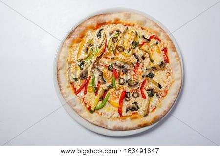Fresh Pizza With Pepper, Cheese And Mushrooms On White Plate