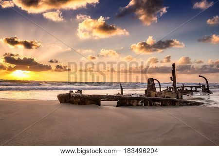 Sunken ship shot at sunset at Hof Dor, Israel.