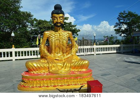 A sage convicted in gold expects parishioners in the tourist city of southeast Asia. Prophet to a buddha is ready to listen to a pilgrim and friends and help everyone.