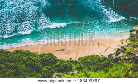 Top Aerial view of Nunggalan Beach near Uluwatu, Bali, Indonesia.