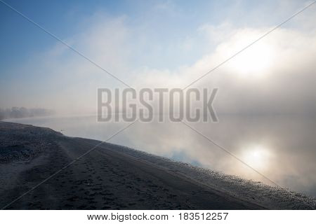 Morning on the river early morning reeds mist fog and water surface on the river