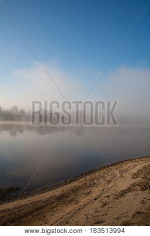 Morning on the river early morning reeds mist fog and water surface on the river