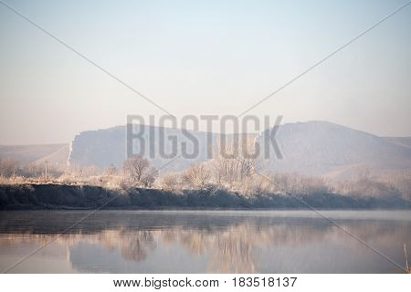 Morning on the river early morning reeds mist fog and water surface on the river