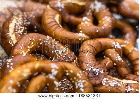 Group of Oktoberfest salted soft Bavarian pretzels, selective focus