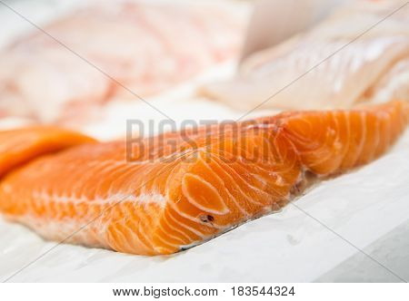 Fillet Fresh Uncooked Seafood Salmon On Showcase Of Seafood Market.