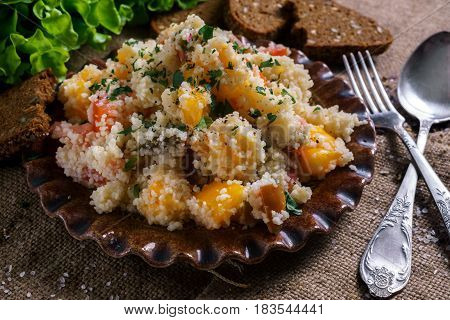 Homemade Fresh Couscous salad with tomatoes in plate