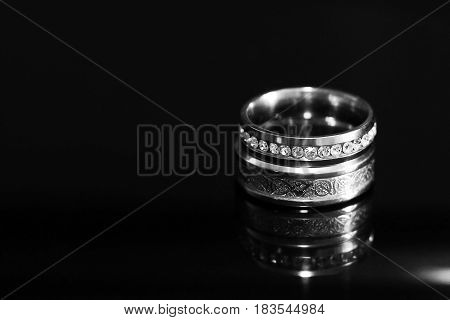 Wedding Rings On A Black Glossy Background