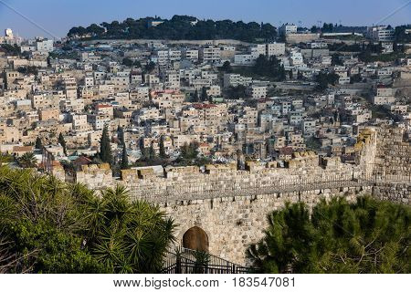 Jerusalem view on the wall of the old city on sunny day with blue sky. Capital of Israel. Israel landmark. Travel and vacation concept.