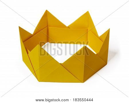 Origami paper yellow gold king crown irony on a white background