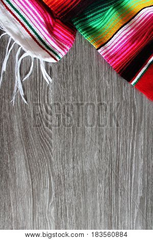 poncho serape background Mexican cinco de mayo fiesta wooden copy space