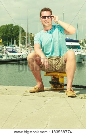 Man Walking On Marina During Summer