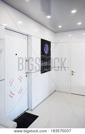 Modern home hallway interior. White plactic panels and tiles. Futuristic interior concept design. Space ship at home. Elements of this image furnished by NASA.