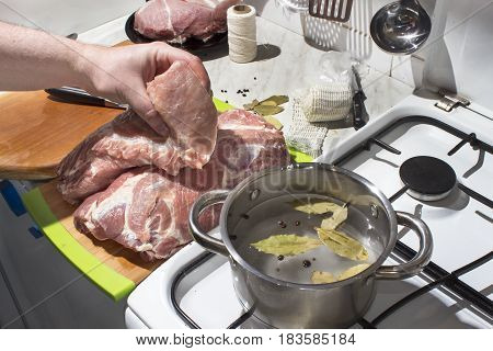 Preparation raw meat for smoking. Pork neck meat and bacon. Picking raw meat in brine. Soaking of meat in brine