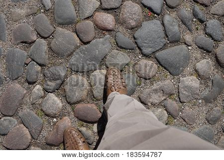 Stone pavement. Ancient pavement. Road paved with cobblestone