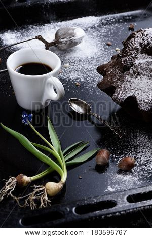 Cup Of Fresh Coffee, Homemade Chocolate And Hazelnut Cake On A Baking Tray. Close Up.