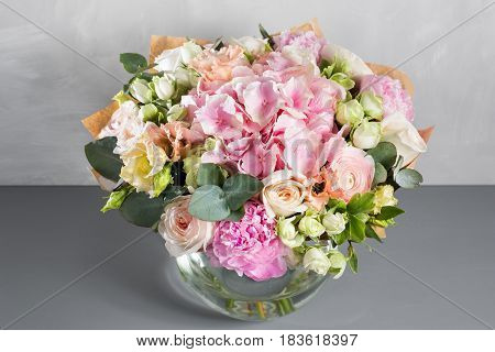 Still life with a bouquet of flowers. the florist put together a beautiful bunch of flowers. Man manual work used different types of flowers and colors.