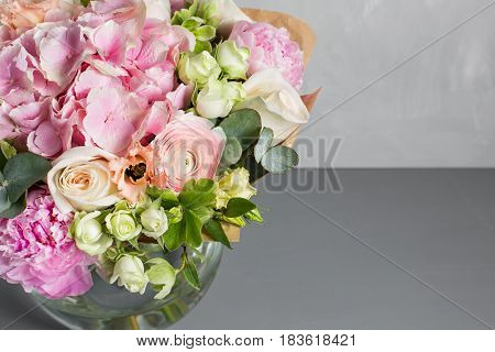 Still life with a bouquet of flowers. the florist put together a beautiful bunch of flowers. Man manual work used different types of flowers and colors.