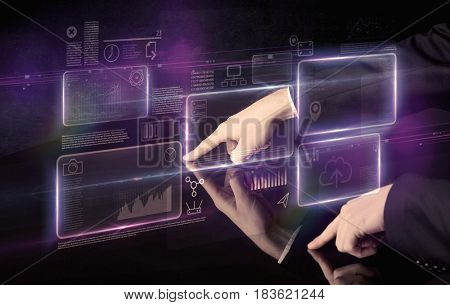 Male hands touching interactive table with purple cloudspace graphic on it 