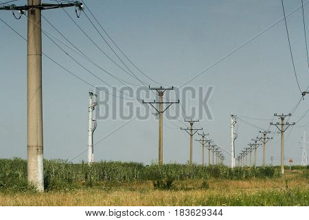 BUZAU ROMANIA June 18 2016: High voltage electricity pylons on a field.