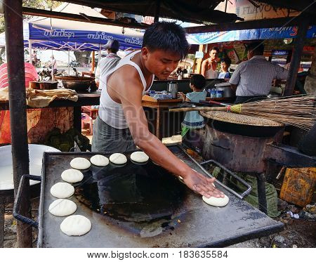 Vendor Cooking Street Food In Mandalay, Myanmar
