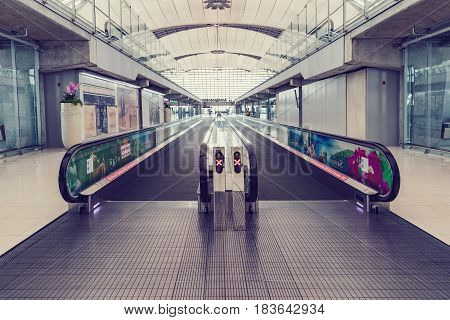 BANGKOK THAILAND - MARCH 7 2017 Moving escalator at the airport for passengers. walkway for passengers boarding walkway in airport. Passengers walk to the gate for boarding