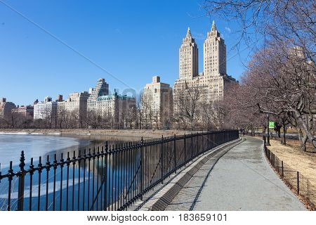 New York City - Panoramic view of modern buildings of upper west side Manhattan from Central Park with Jacqueline Kennedy Onassis Reservoir.